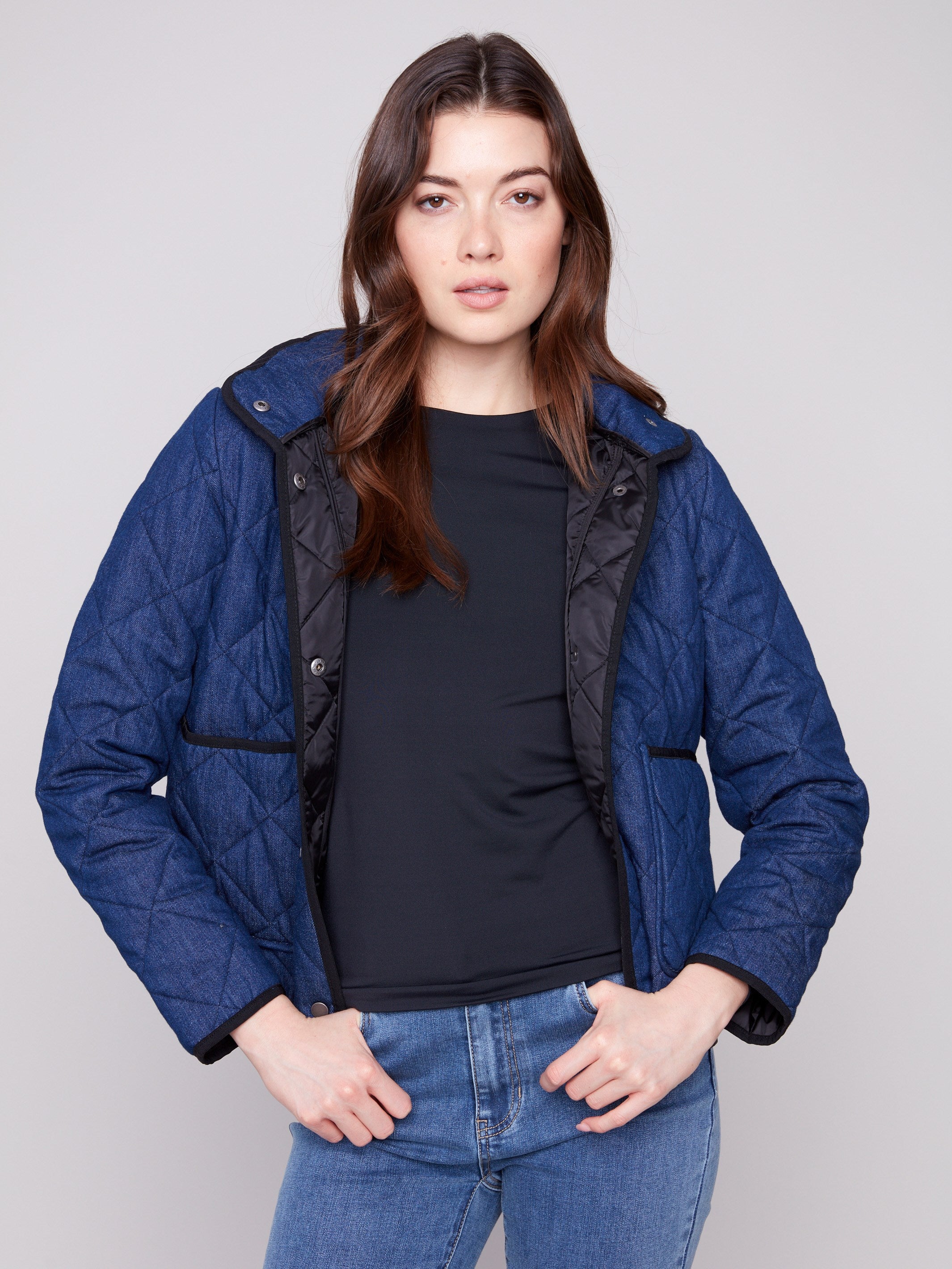 Blue denim jacket featuring a removable hood and convenient front patch pockets, designed for versatility by Charlie B.