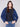 Blue denim jacket featuring a removable hood and convenient front patch pockets, designed for versatility by Charlie B.
