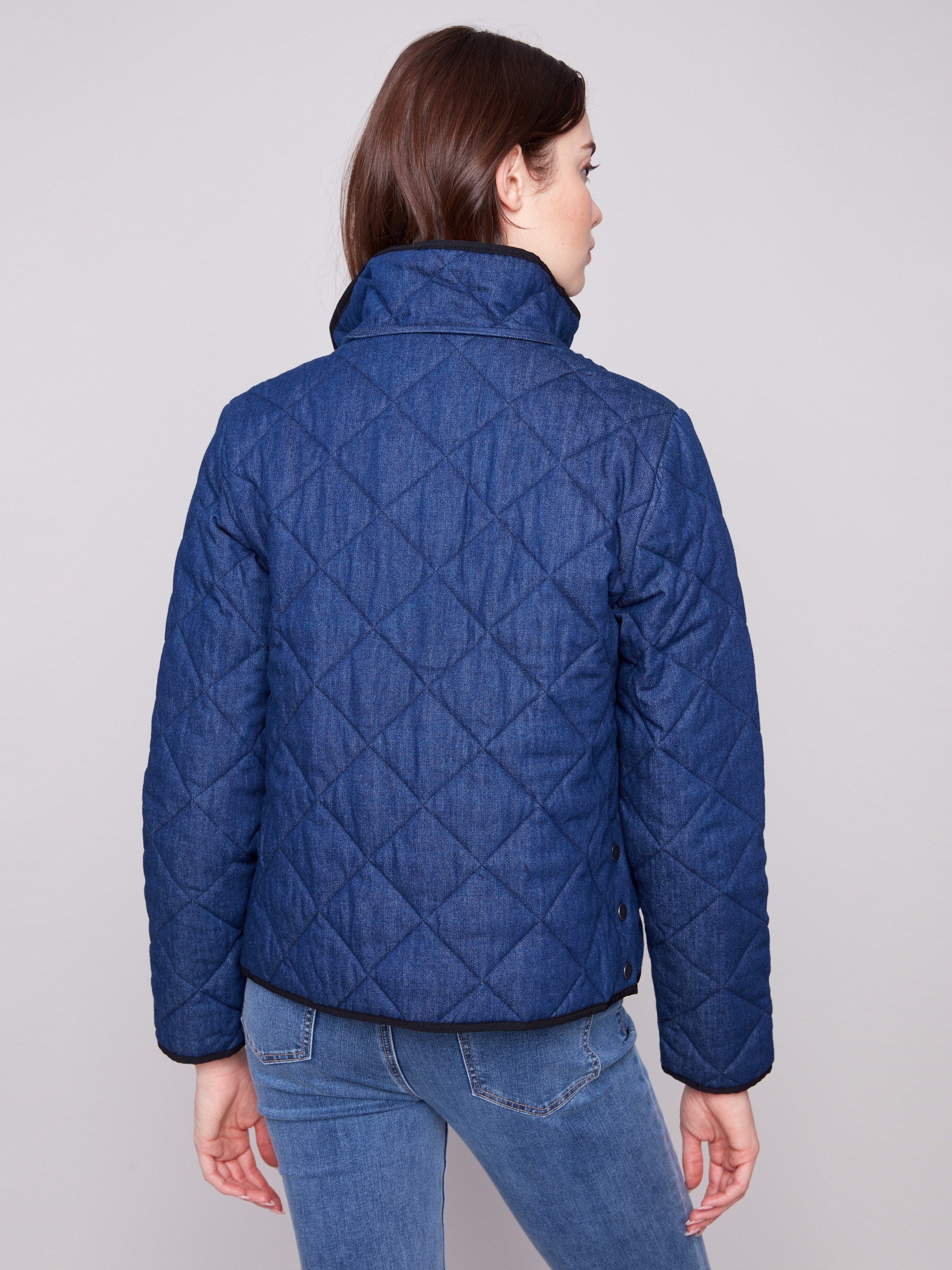 Stylish denim puffer jacket showcasing snap button front and hem closure for a sleek look by Charlie B.
