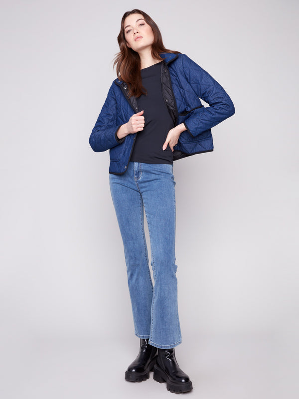 Chic denim quilted puffer with high collar and removable hood, offering both style and comfort by Charlie B.