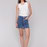Medium blue denim shorts featuring no side seams by Charlie B.