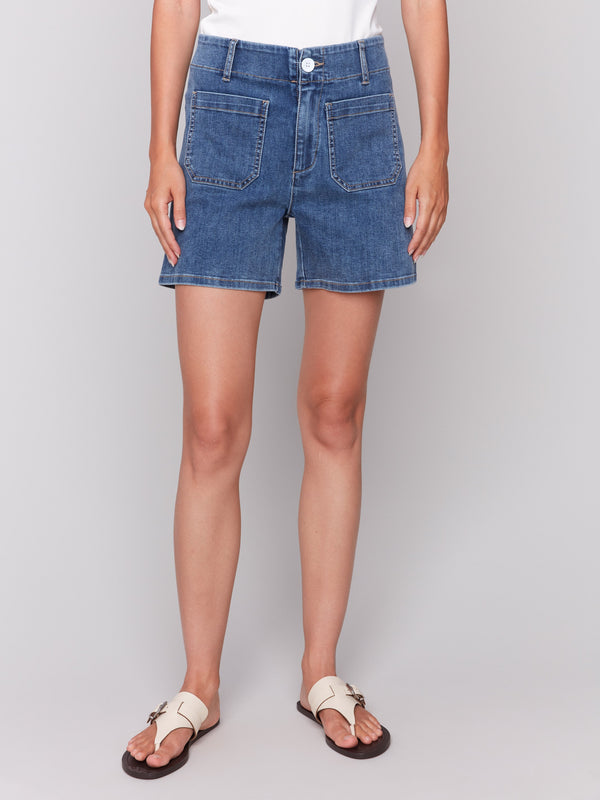 Blue denim shorts with front and back patch pockets by Charlie B.