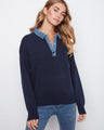 Navy sweater featuring a denim shirt collar for a chic contrast, perfect for casual outings or layering. By Charlie B.