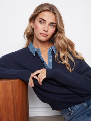 Casual yet refined, this navy sweater features ribbed hem detailing, making it a must-have staple. By Charlie B.