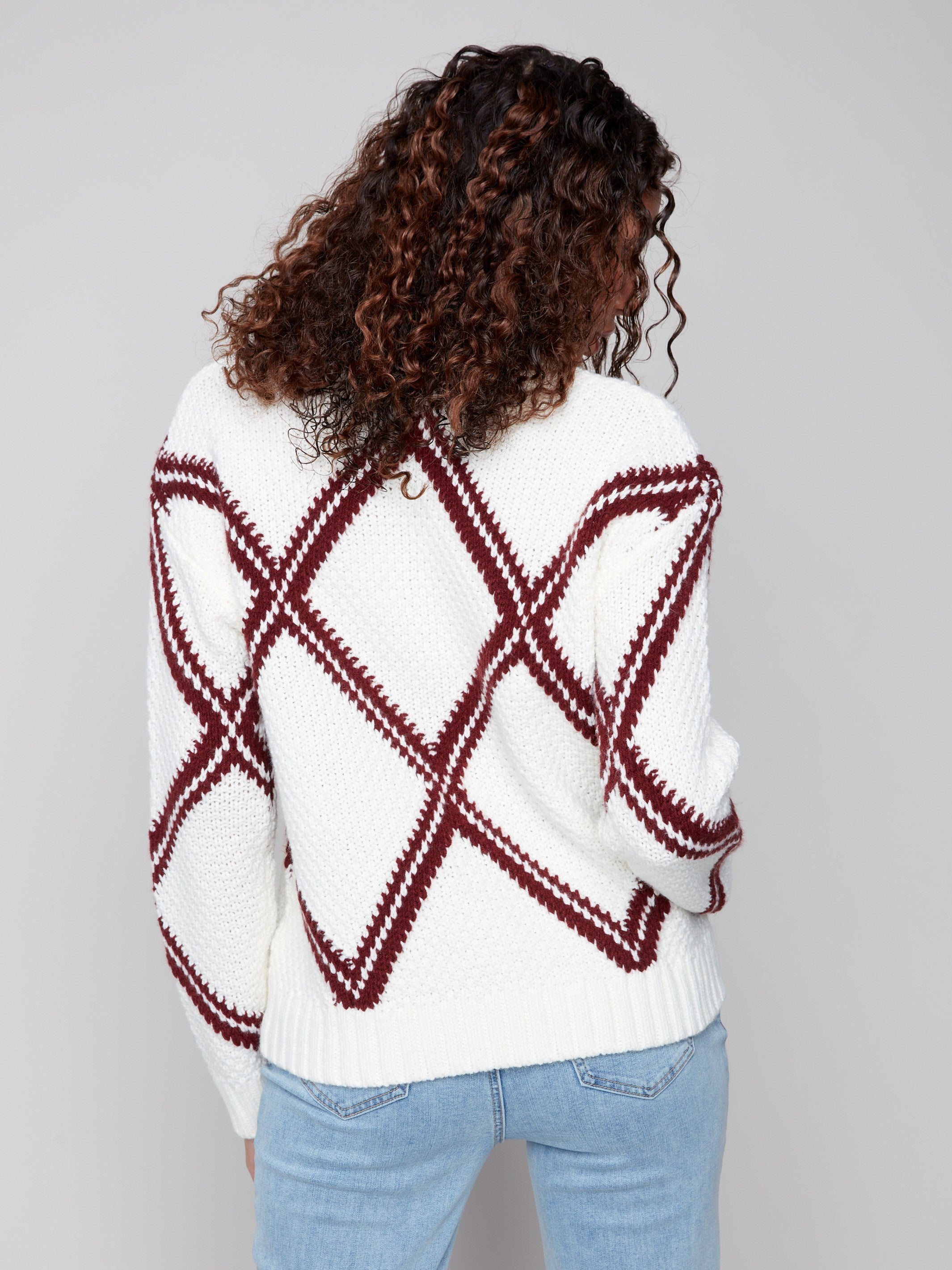 Stylish white sweater with cabernet diamond pattern, highlighted by its soft crew neck for added elegance by Charlie B.