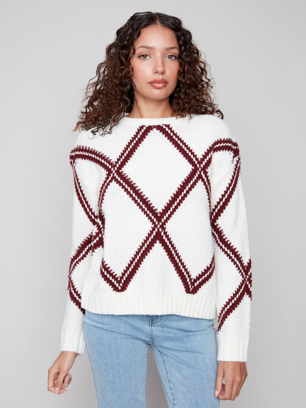 White sweater featuring intricate cabernet diamond intarsia knit, designed for fashion-forward looks with ease by Charlie B.