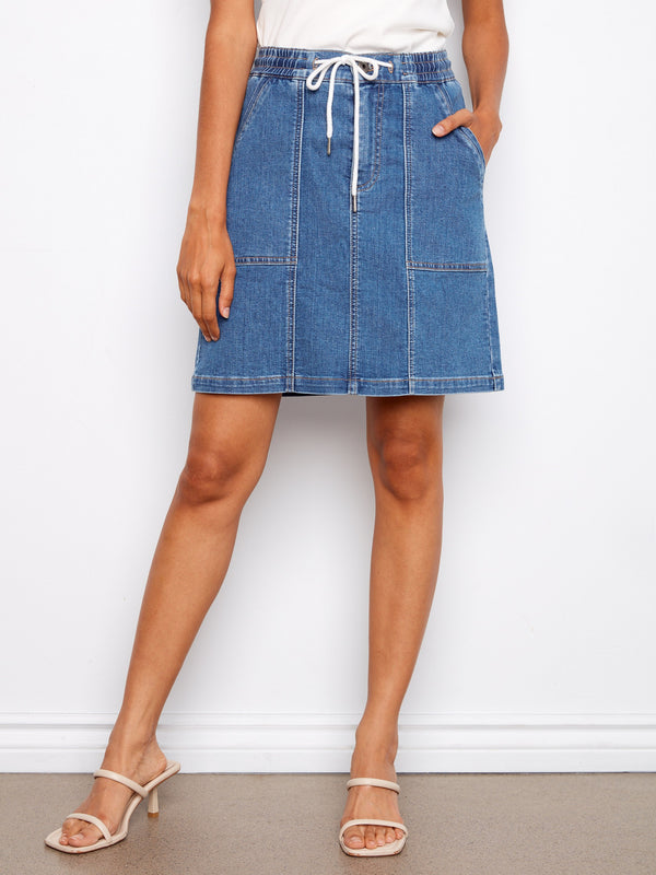 This denim skirt boasts an elastic drawstring waistband for a comfortable fit by Charlie B.