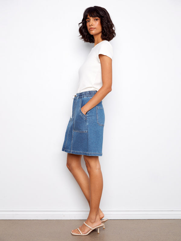 Crafted from stretch denim, this skirt offers both flexibility and style by Charlie B.
