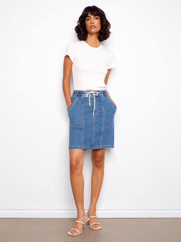 The regular rise design of this denim skirt ensures a classic fit for any occasion by Charlie B.