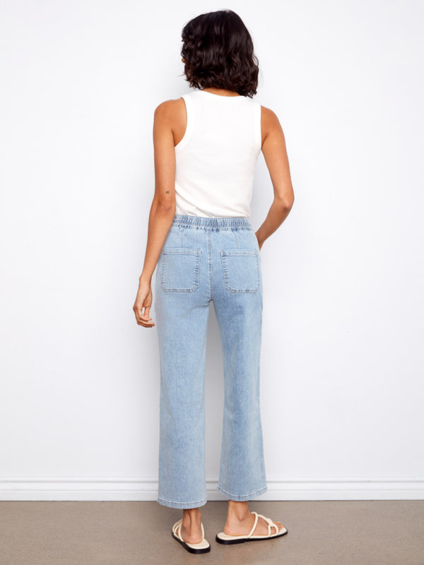 With a regular rise, these jeans sit comfortably on the waist, making them versatile for various tops. By Charlie B.