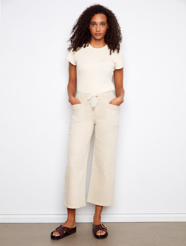 Embrace the chic look with beige wide leg pants in a cropped length, ideal for pairing with your favorite tops by Charlie B.