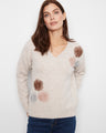 Sweater with a V-neck and charming floral embroidery, offering a stylish touch to your outfit. By Charlie B.