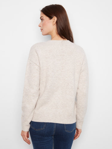 Crafted with long sleeves, this sweater provides warmth without sacrificing style. By Charlie B.