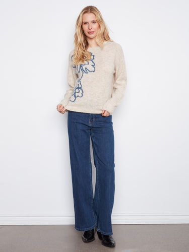 Elevate your wardrobe with this cozy sweater, showcasing ribbed cuffs and hem for a snug fit. Ideal for any casual occasion by Charlie B.