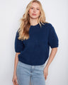 This blue top features a soft brushed knit, offering a cozy and stylish look for any casual occasion. By Charlie B.