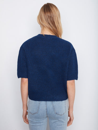 The relaxed fit of this blue knit top ensures comfort while maintaining a chic silhouette for everyday wear. By Charlie B.