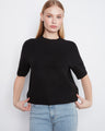 Black sweater with soft brushed knit and elbow-length sleeves by Charlie B.