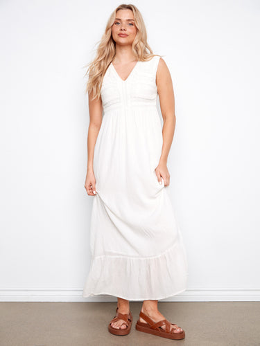 Elegant natural maxi dress with a sleeveless design and empire seam for added sophistication by Charlie B.