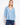 Blue blouse featuring a braided V-neck design, paired with jeans for a stylish look. By Charlie B.