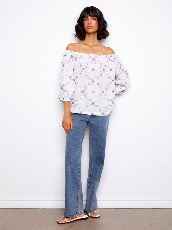 Stylish off-the-shoulder blouse with intricate floral embroidery, crafted in pure cotton and featuring 3/4 sleeves by Charlie B.