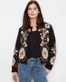 Embrace elegance with this collarless jacket, showcasing a stunning embroidered design. Perfect for any occasion. By Charlie B.