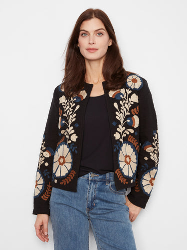 Embrace elegance with this collarless jacket, showcasing a stunning embroidered design. Perfect for any occasion. By Charlie B.