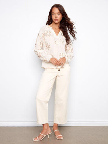 Ecru embroidered blouse featuring a notched neckline and charming raglan sleeves, perfect for any occasion by Charlie B.