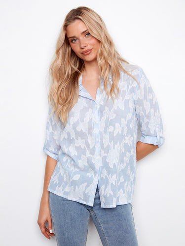 This shirt features a classic collar and is made from 100% cotton, offering both comfort and style by Charlie B.