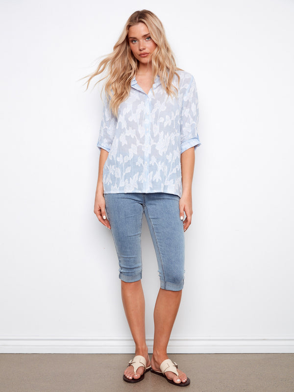 The roll-up 3/4 sleeves add versatility to this all-over embroidered shirt, perfect for any occasion by Charlie B.