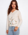 Beige sweater featuring a V-neck design and elegant floral embroidery, crafted from 100% cotton for comfort by Charlie B.