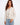 Beige sweater featuring a V-neck design and elegant floral embroidery, crafted from 100% cotton for comfort by Charlie B.