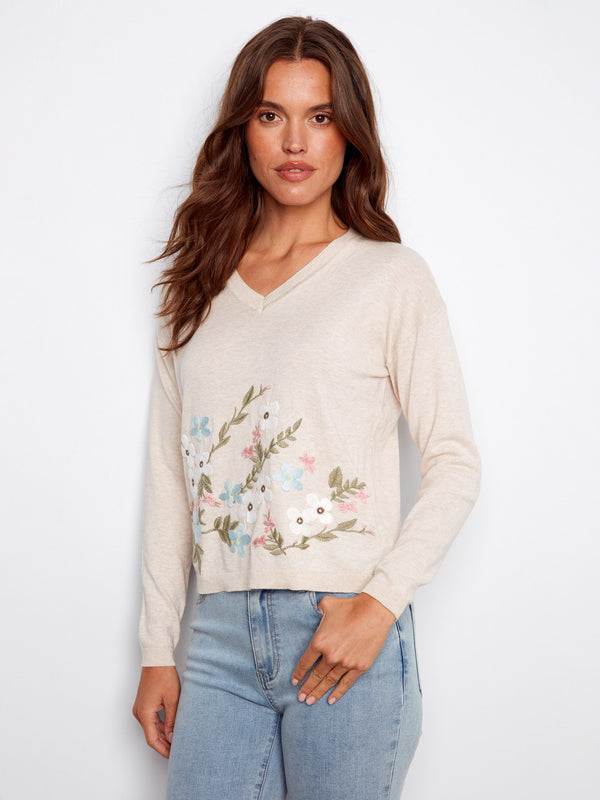 Beige sweater featuring a V-neck design and elegant floral embroidery, crafted from 100% cotton for comfort by Charlie B.