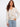 Elegant beige sweater showcasing intricate floral embroidery and a stylish V-neck, designed in 100% cotton by Charlie B.