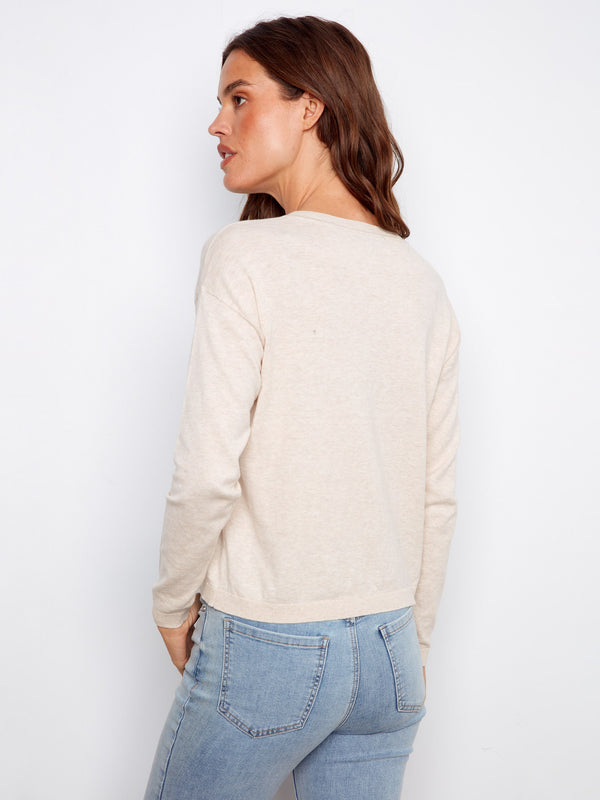 Beige 100% cotton sweater with detailed floral embroidery and a flattering V-neck style, perfect for any occasion by Charlie B.