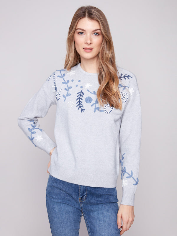 Heather grey sweater featuring a stylish crew neck and intricate floral embroidery by Charlie B.