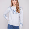 Heather grey sweater featuring a stylish crew neck and intricate floral embroidery by Charlie B.