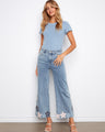 These jeans feature a stylish flared leg, adding a touch of retro flair to your outfit. Perfect for any casual occasion by Charlie B.