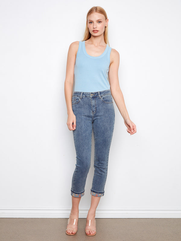 Embroidered cuffed slim-leg jeans in medium blue with stretch denim for ease of movement by Charlie B.