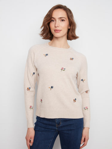 The sweater features a classic crew neck, offering a timeless and versatile look for any wardrobe. By Charlie B.