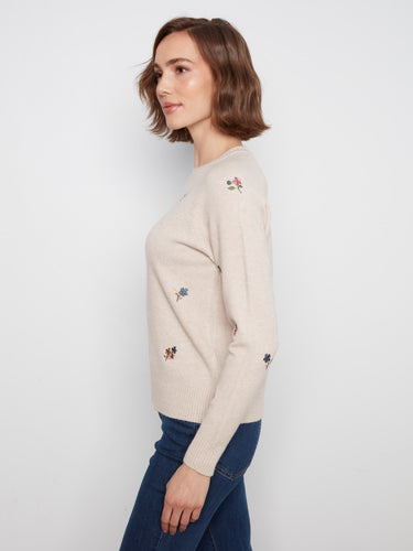 Designed with long raglan sleeves, this sweater ensures comfort and style in every wear. By Charlie B.