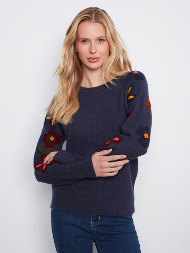 Embrace the beauty of this sweater's embroidered floral design, perfect for adding flair to any outfit. By Charlie B.