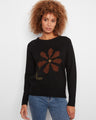 Black sweater with crew neck and distinct floral embroidery, perfect for any season by Charlie B.