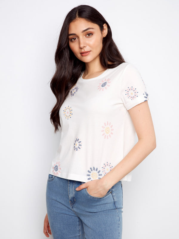 Elegant embroidered front on a soft cotton tee, designed by Charlie B.