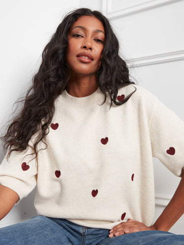 Adorned with balloon elbow sleeves, this sweater offers a unique blend of style and comfort for any occasion. By Charlie B.