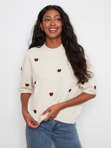Experience effortless style with the relaxed fit of this sweater, ideal for layering or wearing on its own. By Charlie B.