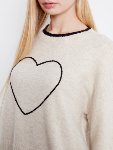 Long sleeves provide warmth and versatility, making this sweater an ideal choice for layering in cooler weather. By Charlie B.