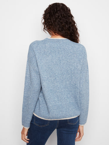 Blue sweater adorned with elegant heart embroidery and crafted with drop shoulders for added comfort by Charlie B.