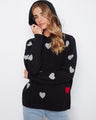Stylish black hoodie adorned with embroidered hearts, featuring ribbed cuffs and hem for a cozy fit. By Charlie B.