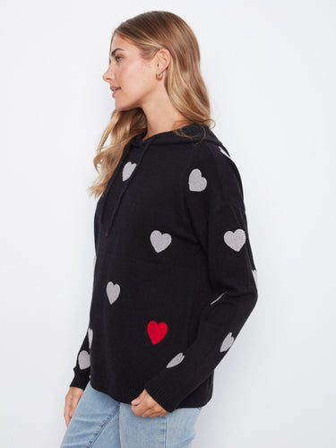 Cute heart-print sweater featuring long sleeves, ensuring both comfort and charm in your wardrobe collection. By Charlie B.