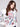 Charming ecru sweater with colorful heart and leaf embroidery, featuring elegant puff sleeves by Charlie B.